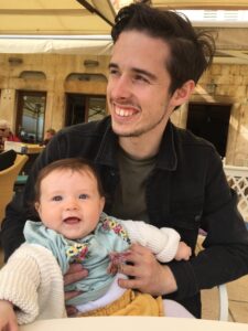 new dad holding baby girl